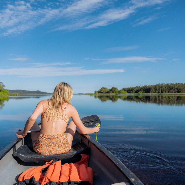a person standing in front of a body of water